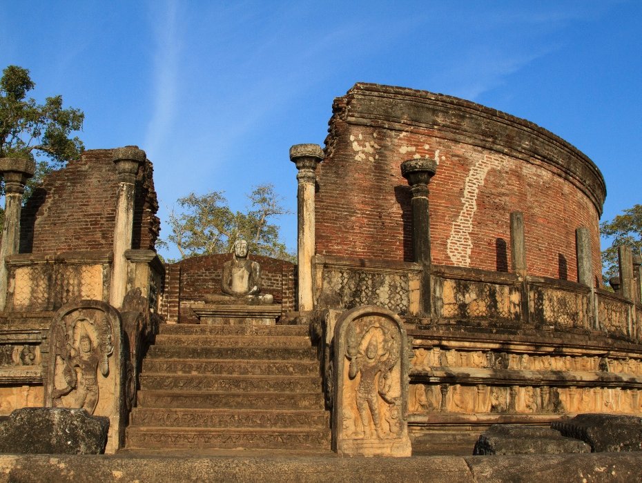 Ancient circular vatadage with carved guardstones and Buddha statue at Polonnaruwa UNESCO World Heritage Site